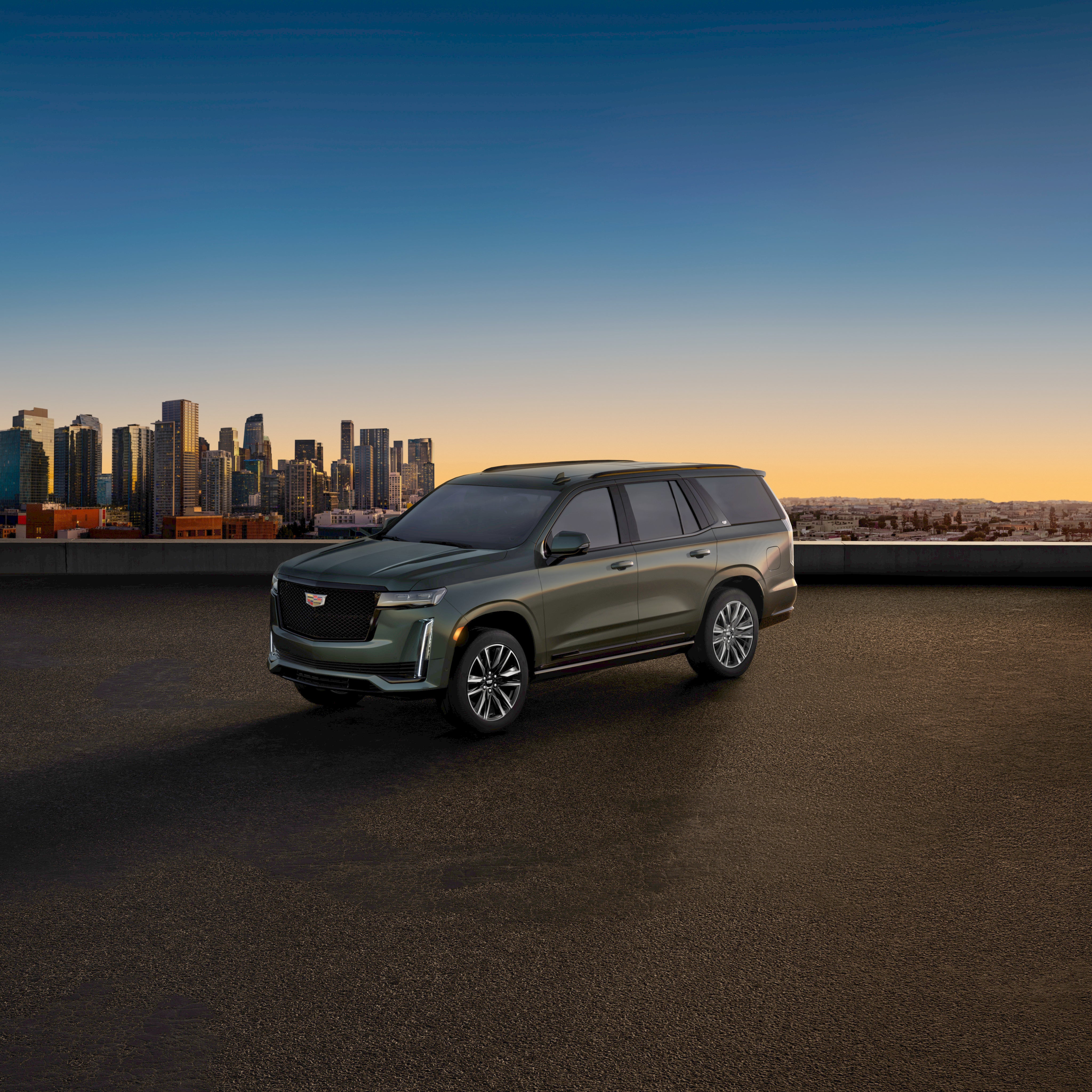 A blue cadillac car parkednear wall half front view