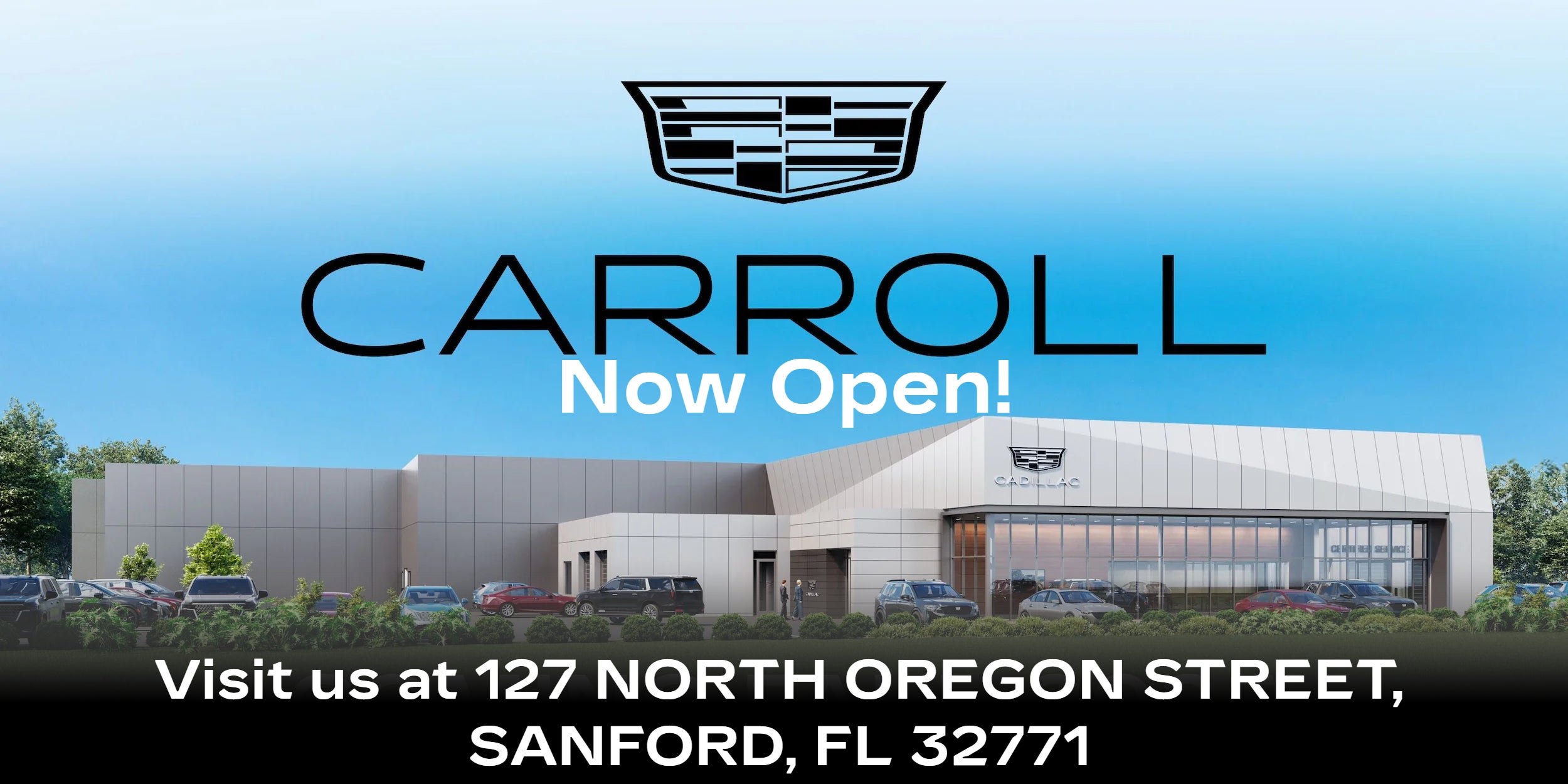 Carroll Automotive Group Building with a lawn and parked cars in front